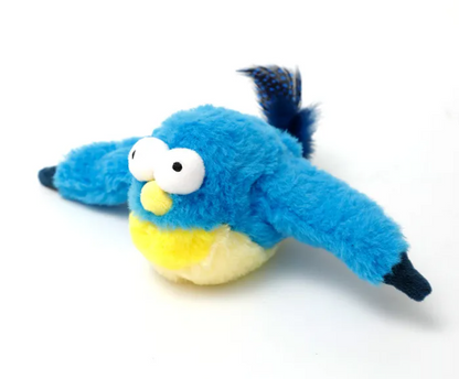 Blue plush bird with large white eyes, a yellow beak and belly, and dark blue tail and crest.