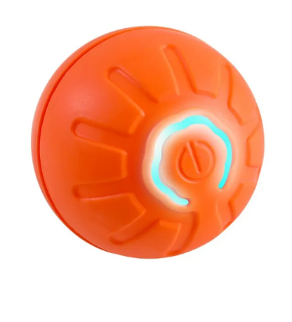 Close-up of an orange grooved ball with a glowing ring around its central button.